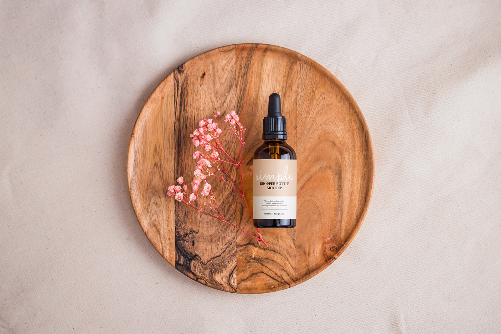 Amber bottle with dried flowers mockup