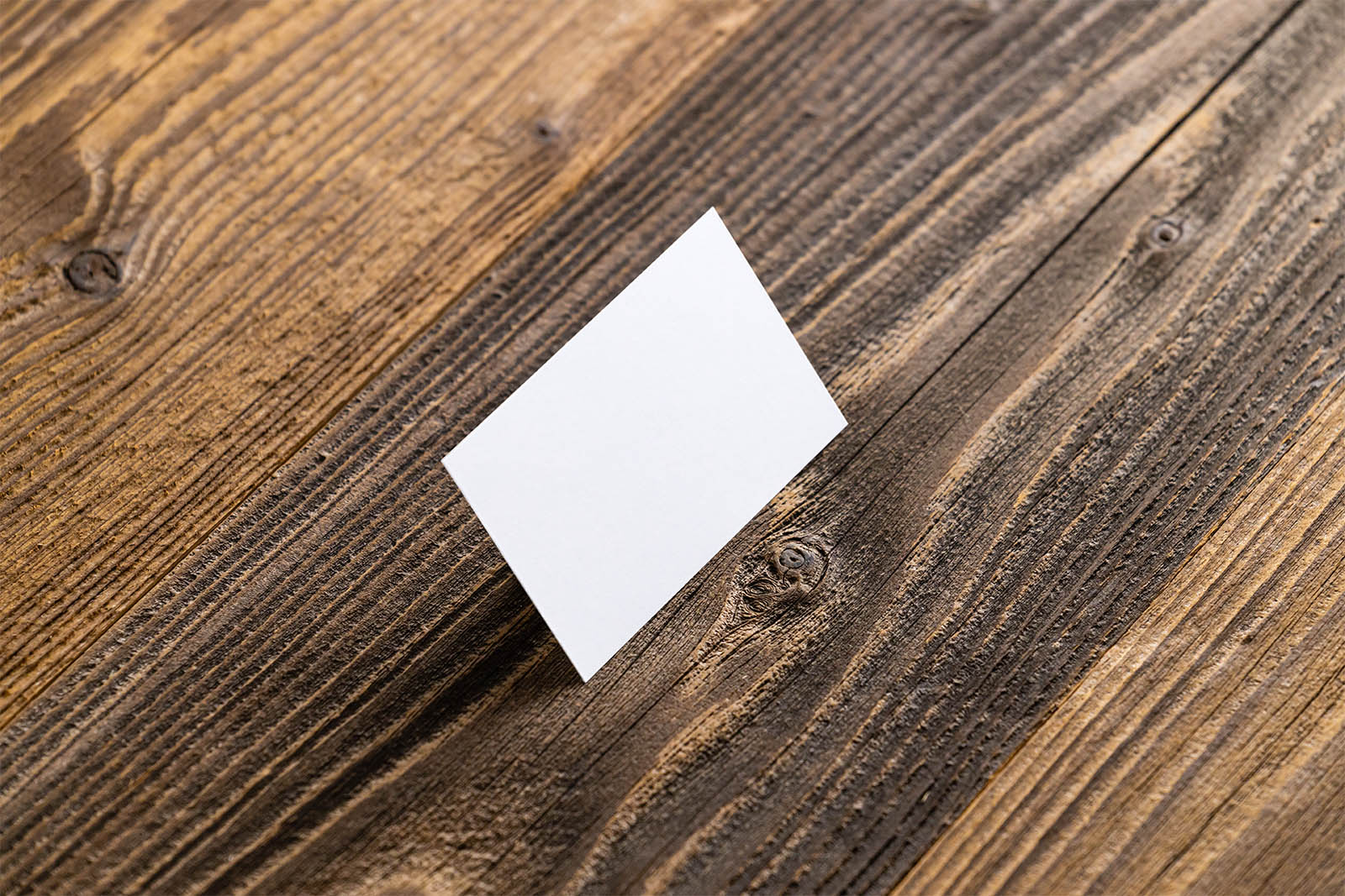 Business card on wooden planks mockup
