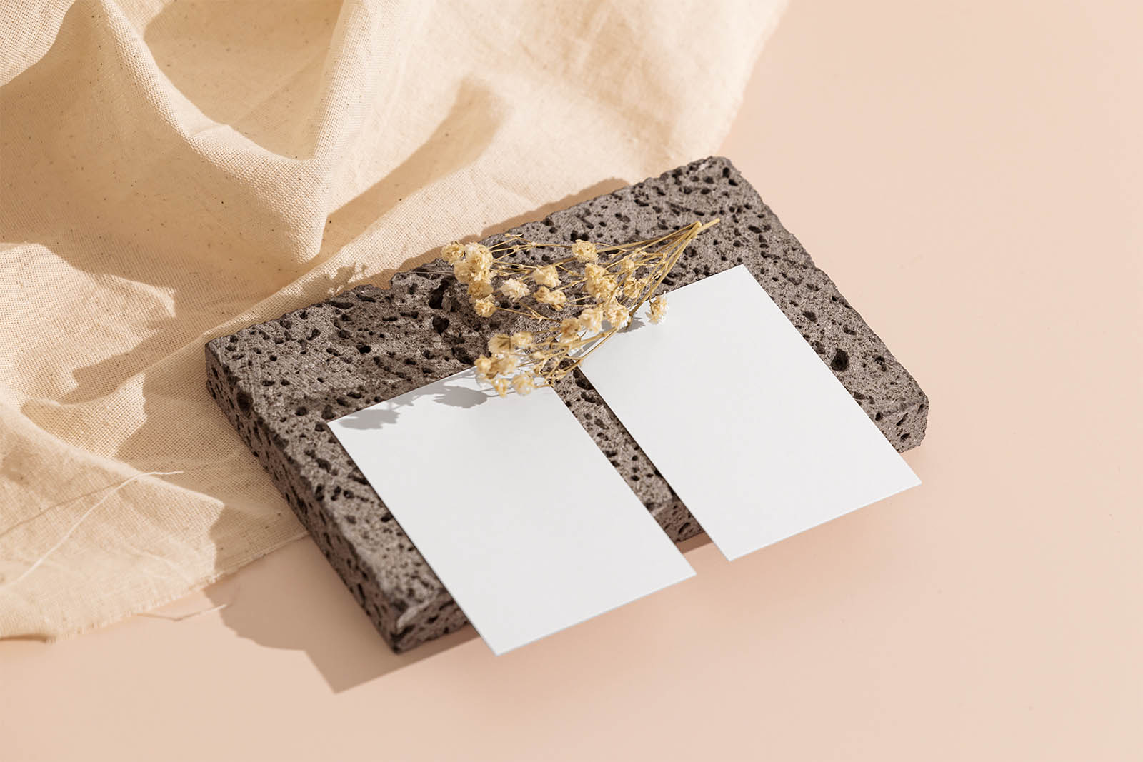 Two business cards on stone mockup