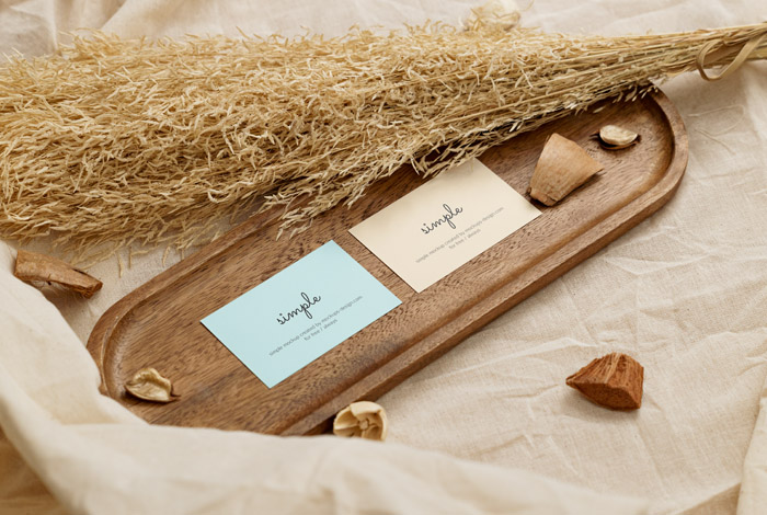 Two business cards in wooden tray mockup