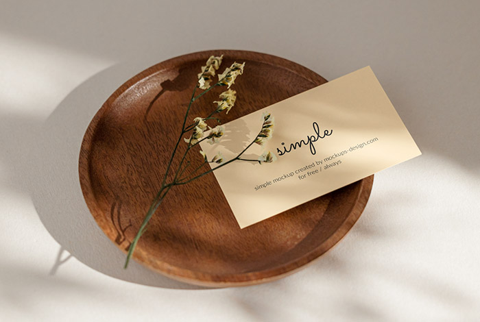 Business card with flower on tray mockup