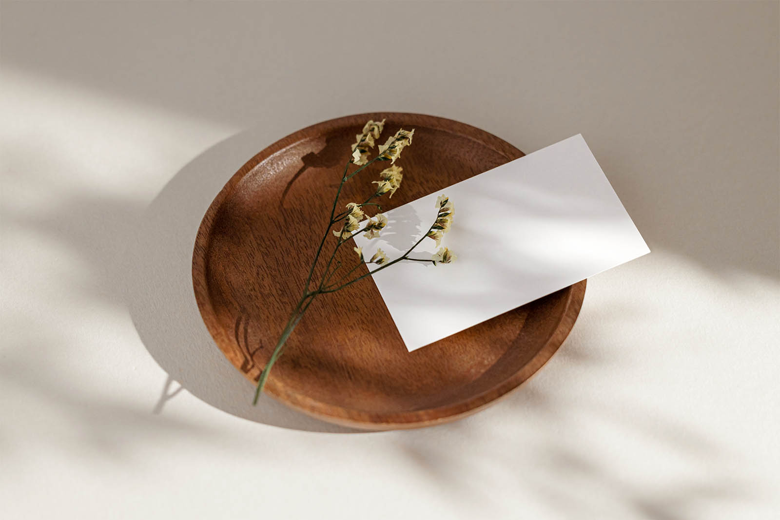 Business card with flower on tray mockup