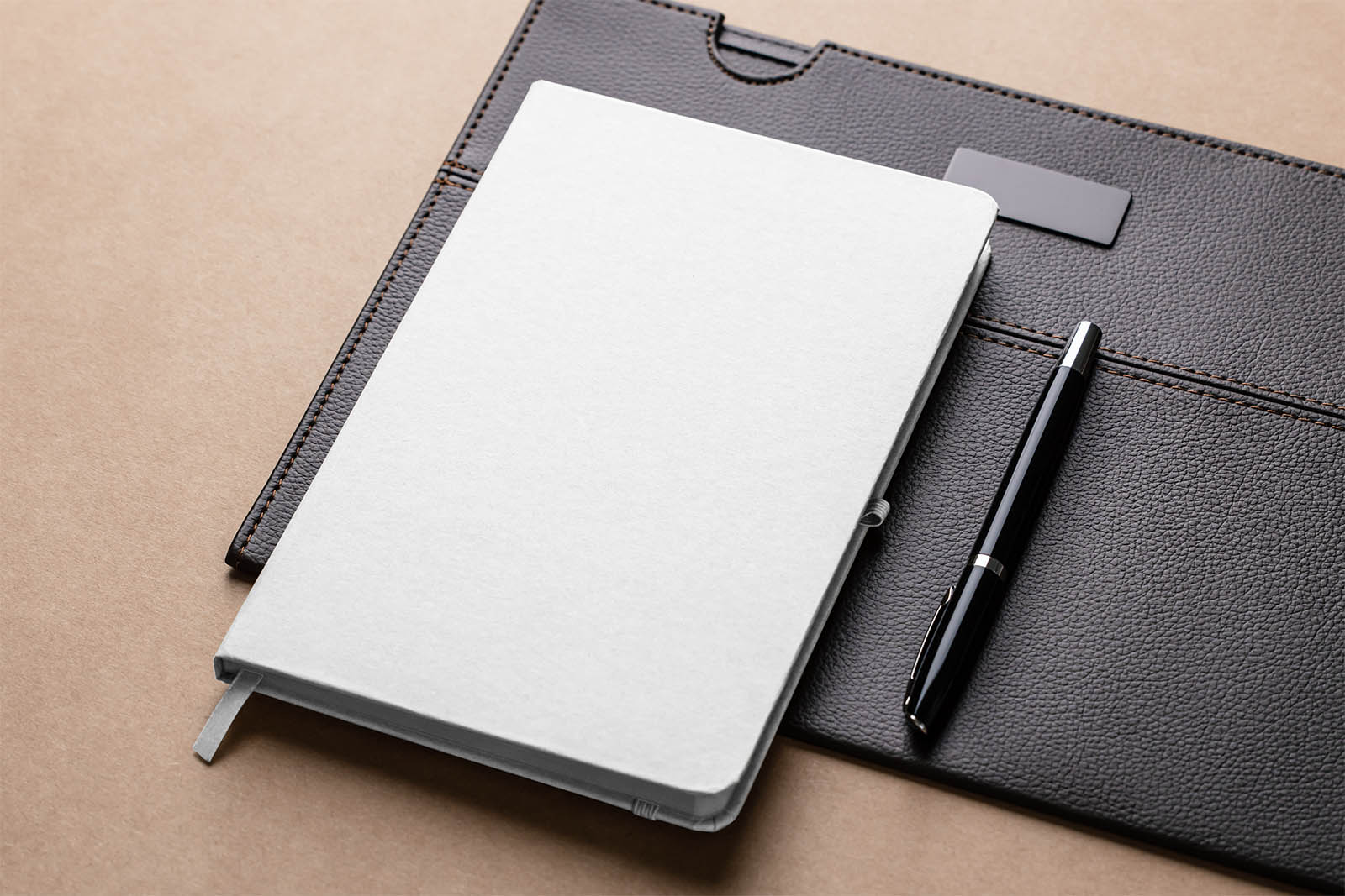 Notepad on leather pad mockup