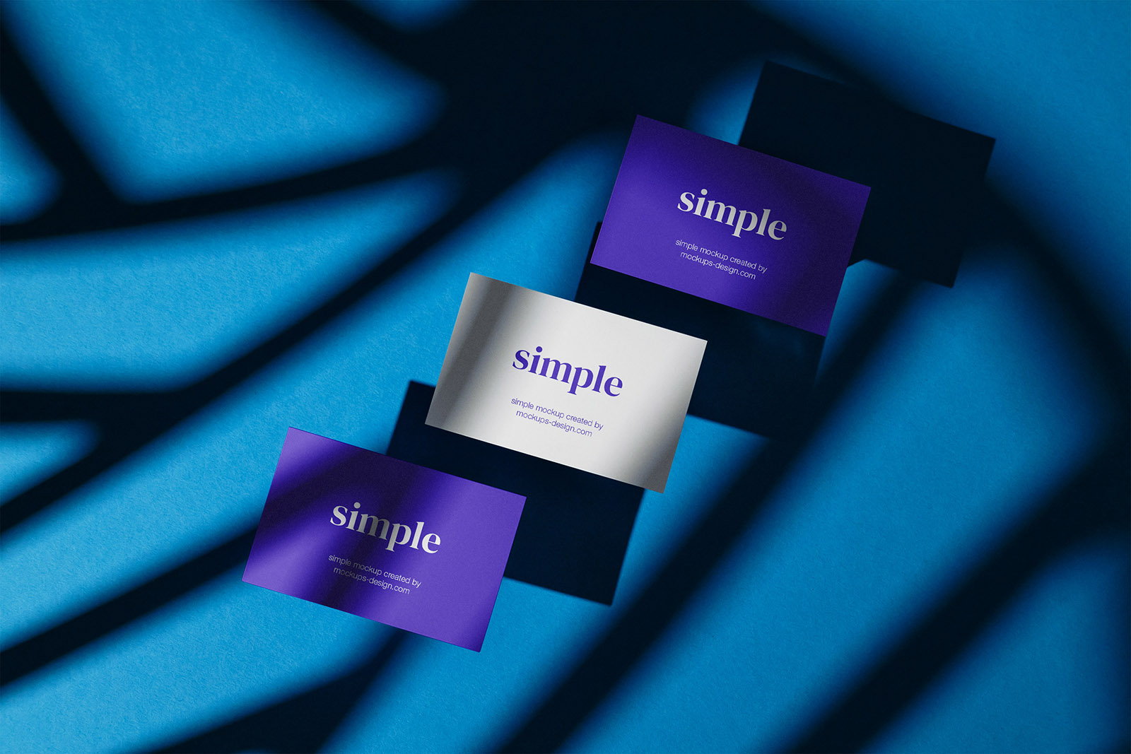 Three business cards on blue background