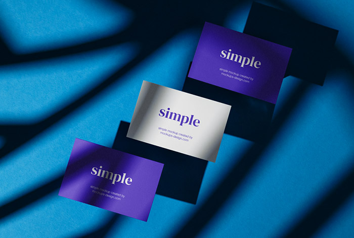 Three business cards on blue background