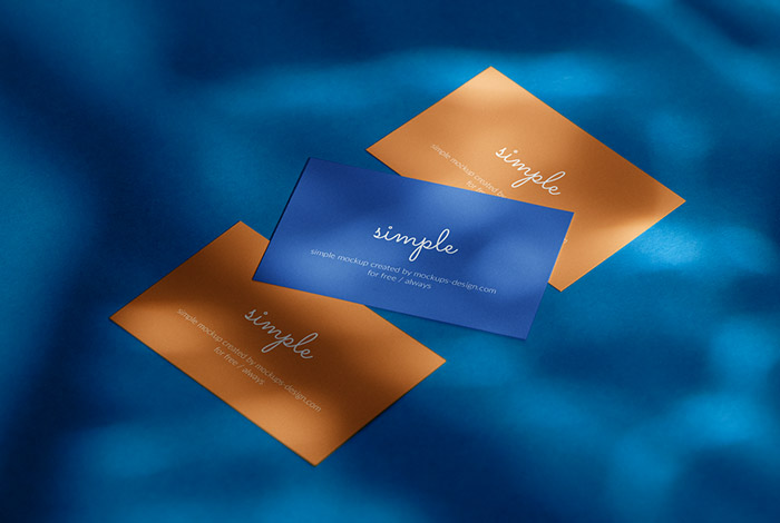 Three business cards on blue background mockup