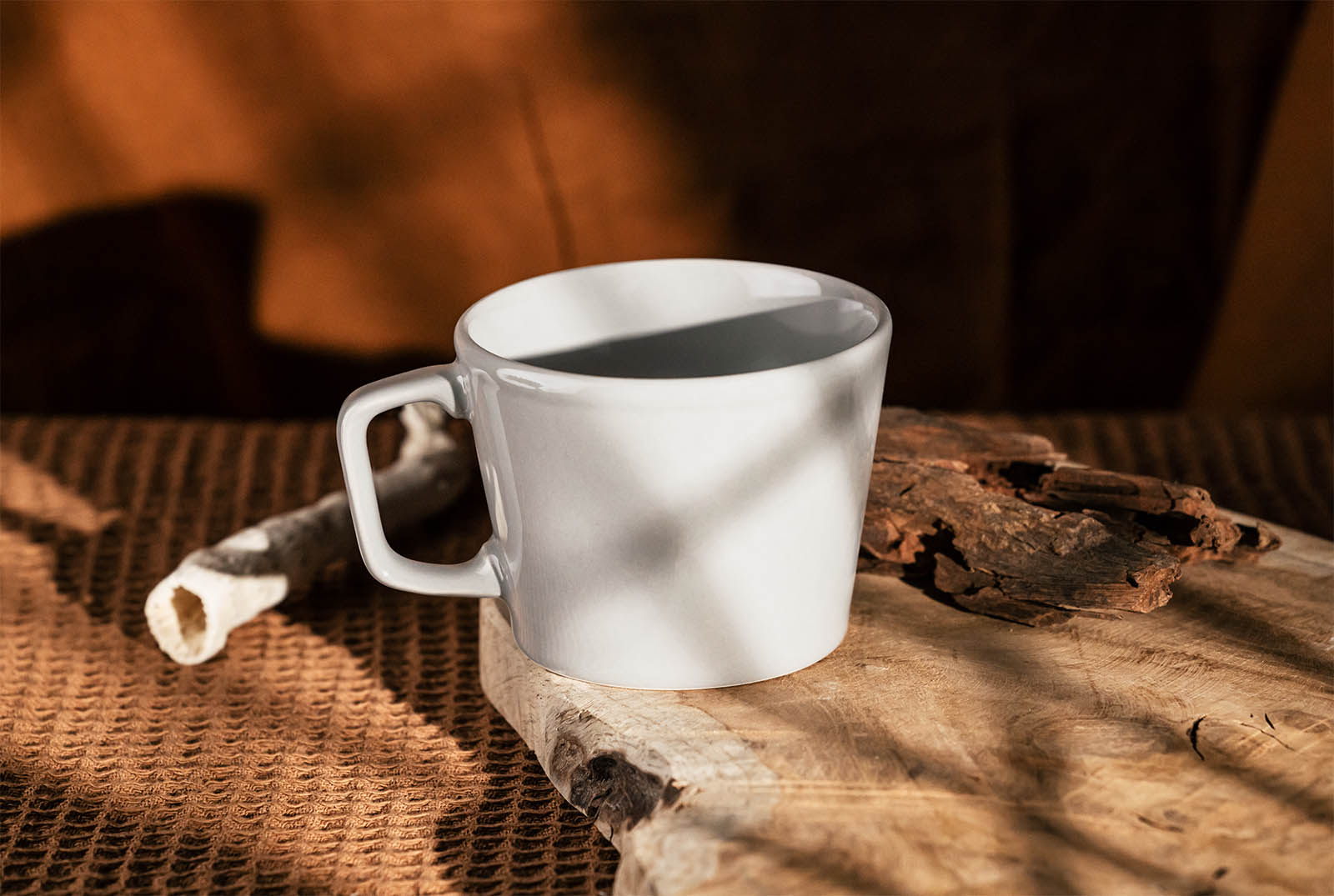 Coffee mug on a wood slice mockup