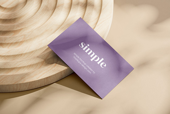 Business cards mockup on wooden ornament