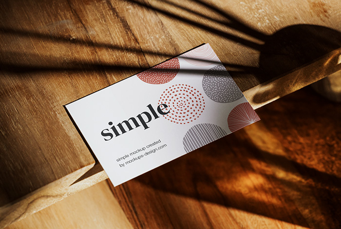 Download Free Business card on wooden table mockup