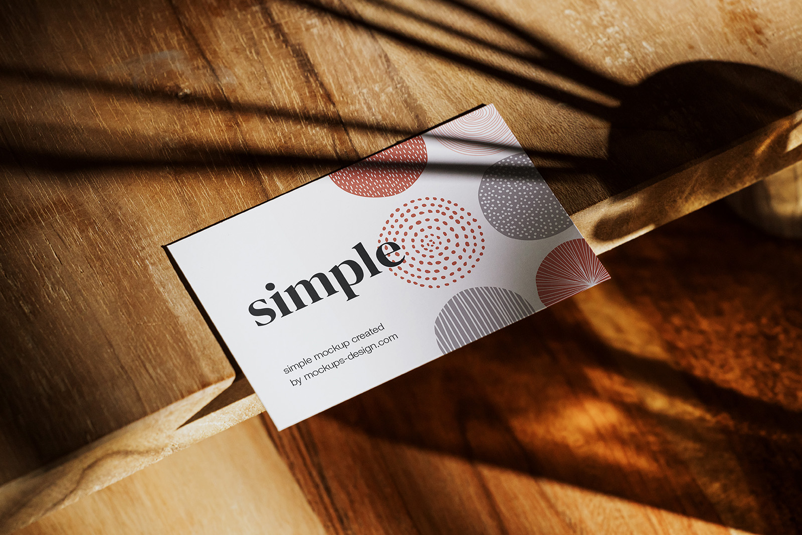 Business card on wooden table mockup