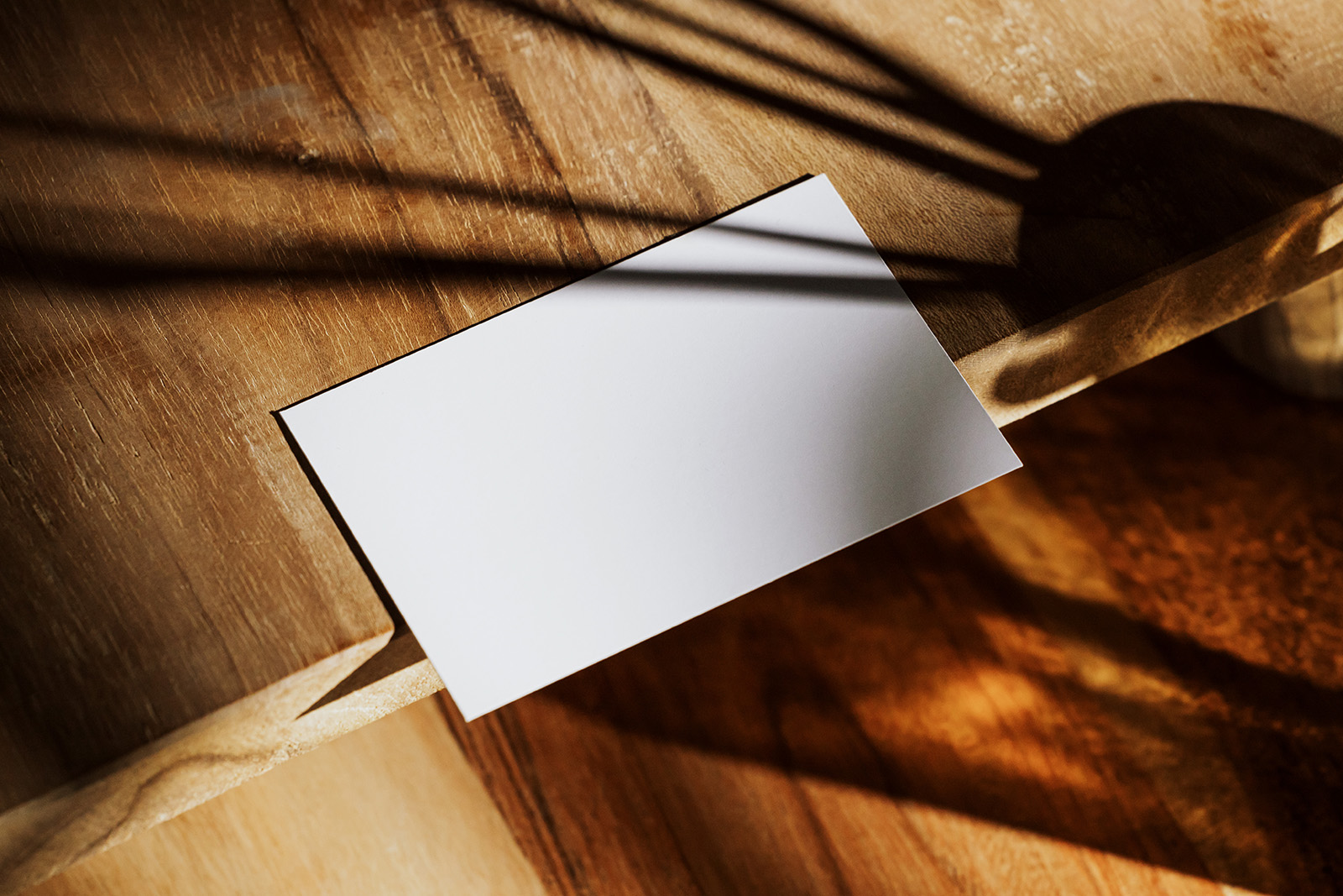 Business card on wooden table mockup