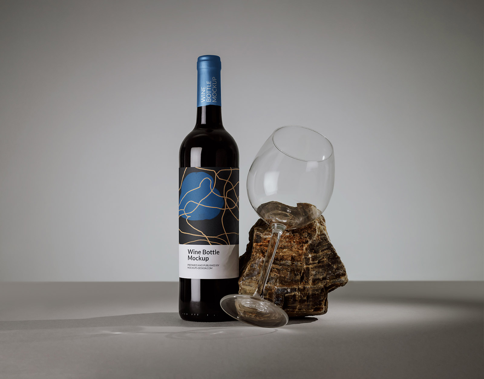 Wine bottle with a glass mockup