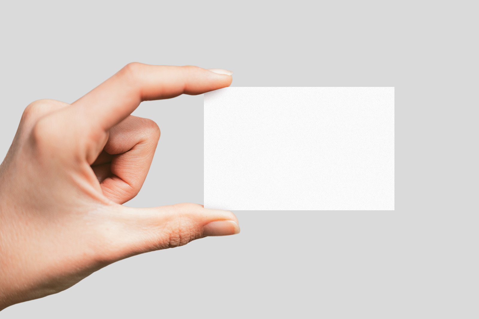 Hand holding business card mockup