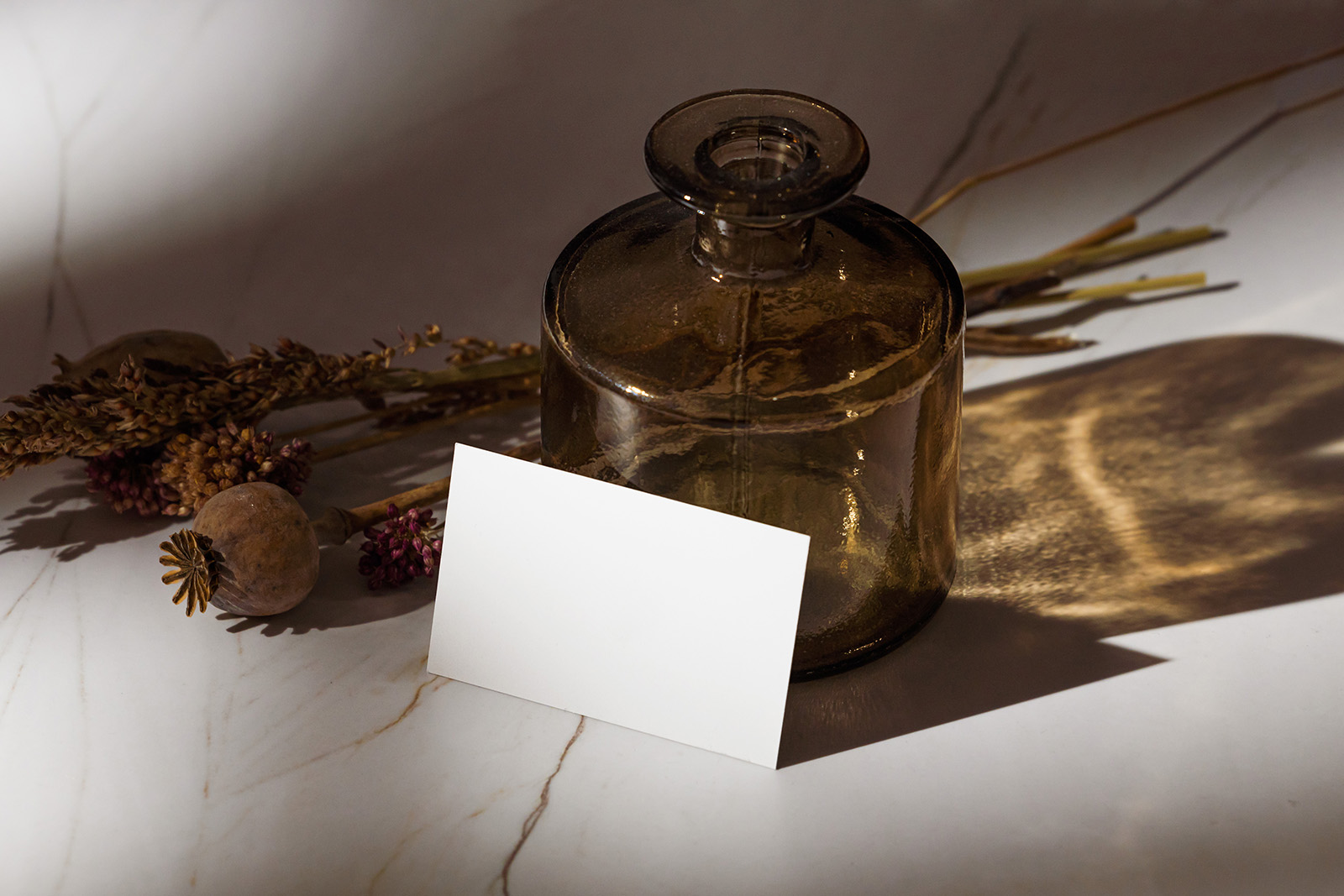 Business card with marble and bottle mockup