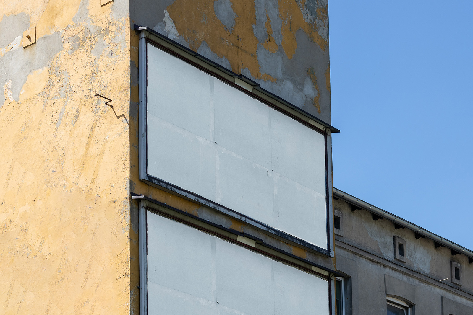 Billboards on old damaged building mockup