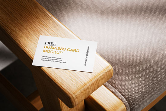 Business card lying on armchair mockup