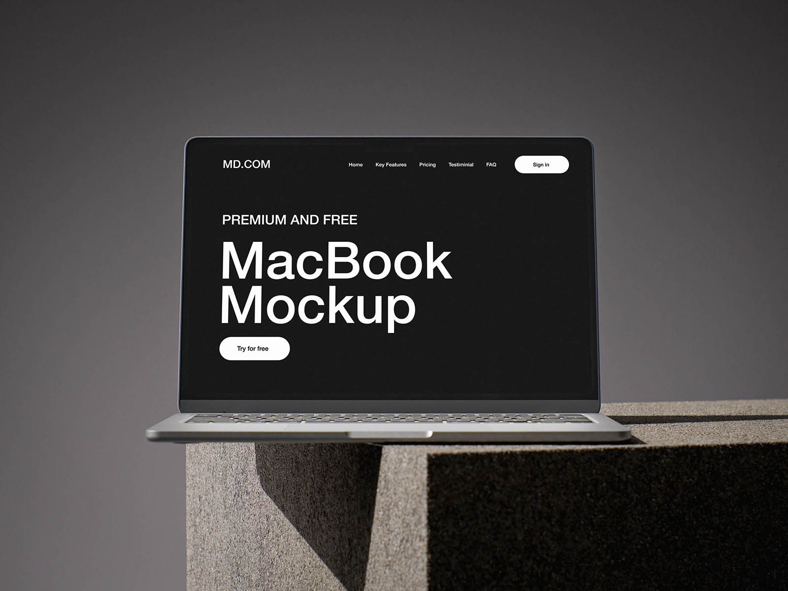 MacBook on concrete cube mockup