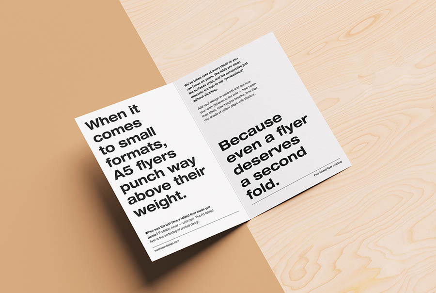 Folded A5 flyer on natural background mockup